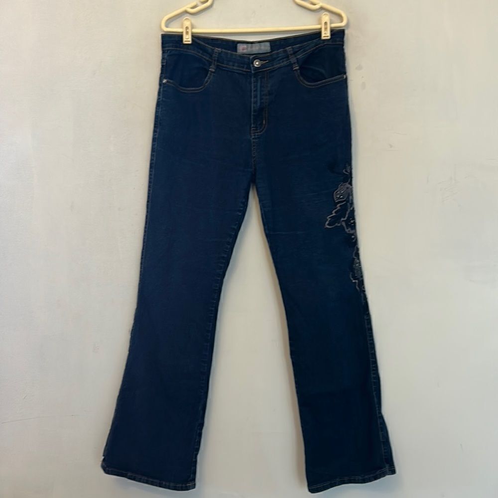 COS jeans with embroidered floral design down left leg. Size 12